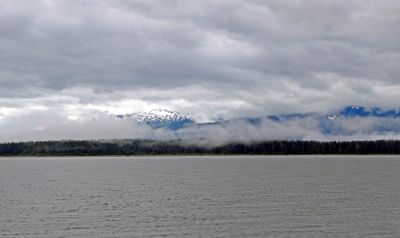 Snow-covered mountains were barely visible through the clouds in Tracy Arm Fjord