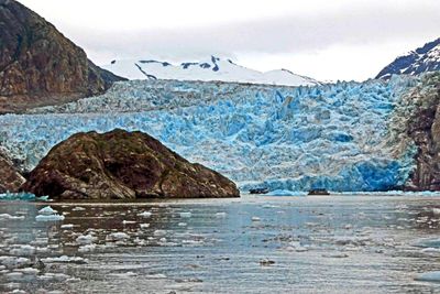 Snow-covered mountains behind South Sawyer Glacier