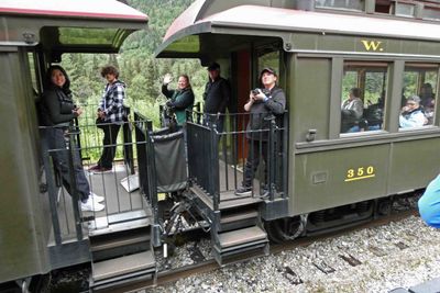 Train platform on passing White Pass & Yukon Railroad Route train