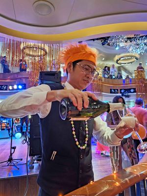 Aaron pouring the champagne that we won in the costume contest