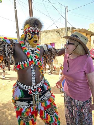 Susan with 'lion dancer' in Senegal.jpg