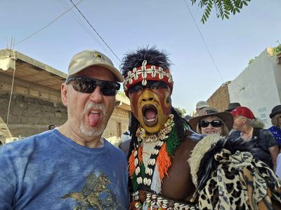 Bill with 'lion dancer' in Senegal.jpg