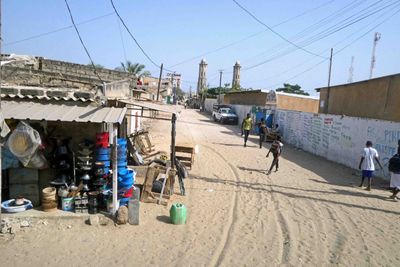Senegalese village has mosque with twin minarets.JPG