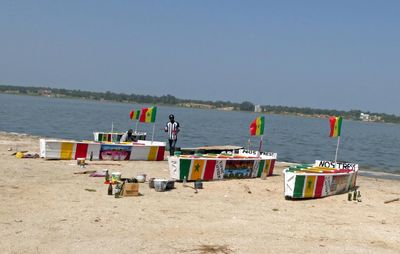 Boats with Senegal flag colors on Lake Retba.JPG