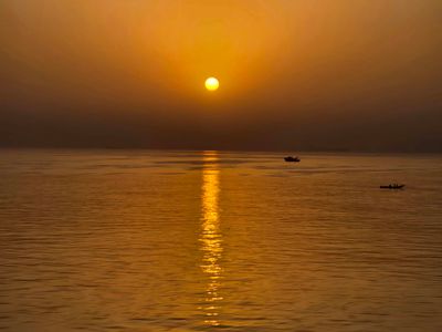 Hazy sunrise off the coast of Dakar, Senegal.jpg