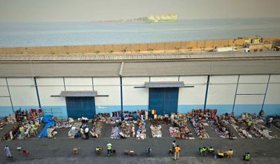 watching vendors on the pier at Dakar, Senegal from our balcony.jpg