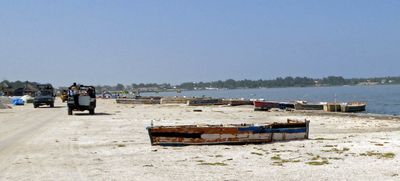 Boats on shoreline of Lake Retba, Senegal.JPG