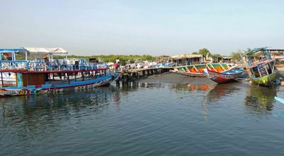 Gambian tour boats on Gambia River.JPG