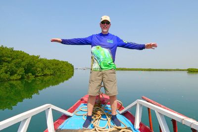 Bill on bow of river boat.JPG