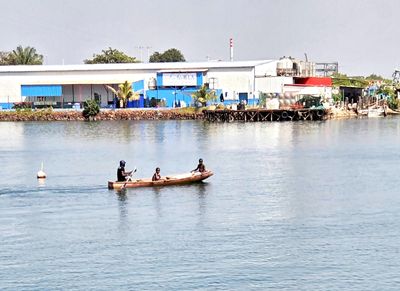 Gambians in dugout canoe