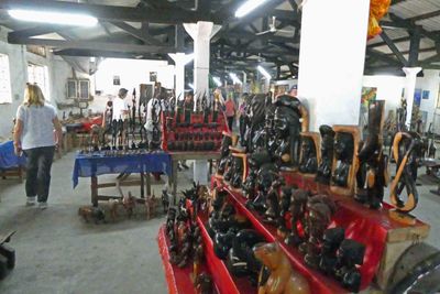 Lots of carved figures in the market in Grand Bassam.JPG