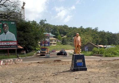 Statue of the President of Ghana in the middle of an unfinished roundabout in Sekondi, Ghana.JPG