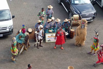 Traditional Togo entertainers on the dock at Loma, Togo.JPG