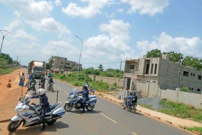 Our police escorts block traffic for our buses to make turns.JPG