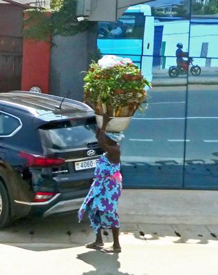 Woman carrying a heavy load.JPG