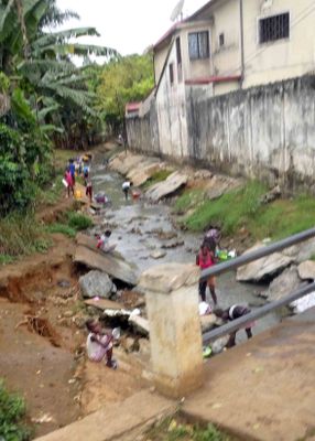 Doing laundry in the fishing village of Pantufo on Sao Tome.JPG