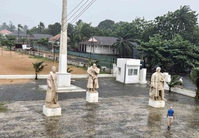 Statues outside Sao Tome Museum are discoverers and first governor of Sao Tome.jpg