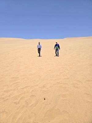 Two of us who made the climb are heading down the dune.jpg