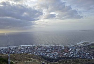 View of Seapoint neighborhood in Cape Town with Robben Island on the far right side.jpg