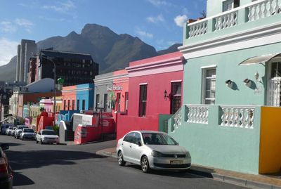 Brightly colored houses in Bo-Kaap dates to a time when freed slaves used color to show their liberty.JPG
