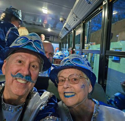 Bill & Kathie on the bus going to load the float.jpg