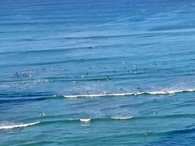 Watching surfers in Waikiki Bay 1st thing in the morning from our hotel balcony