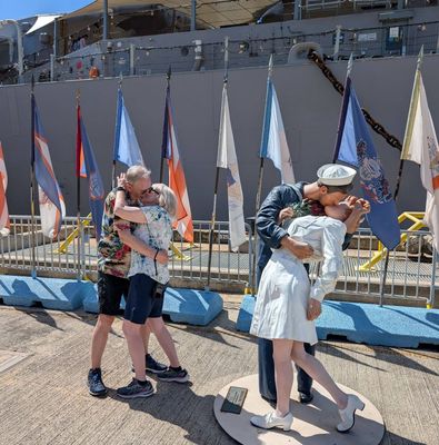 Reinacting iconic kiss in front of USS Missouri