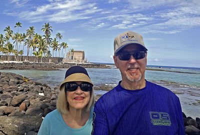 At Puʻuhonua o Hōnaunau National Historical Park with the Royal Mausoleum in the background