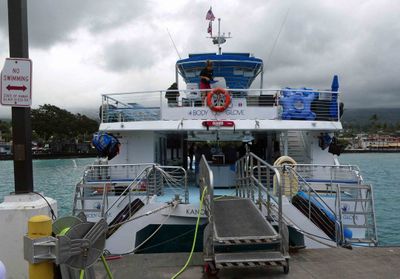 Boarding a Catamaran for our cruise of the coastline near Kona, Hawaii