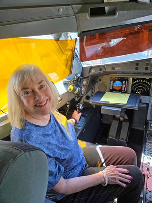 Susan in the cockpit of our Delta plane before takeoff from Honlulu
