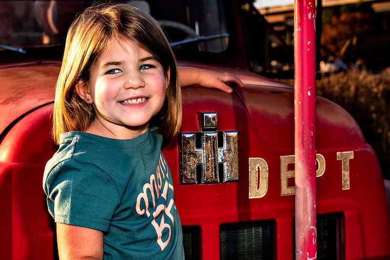 She has always liked trucks and I found this old fire engine that is being used as advertisement for an insurance firm.  So we took some shots.