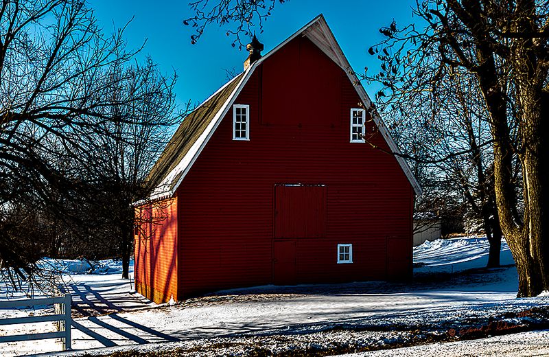The day after a Midwest snow storm, the day is bright and any livestock in this barn is safe. The hay, feed and tack is also safe and the new day can start without any delay. It is always good to see these old barns in good shape as they bring back a lot of memories for an old farm boy.

An image may be purchased at edward-peterson.pixels.com/featured/storm-safe-ed-peterso...
