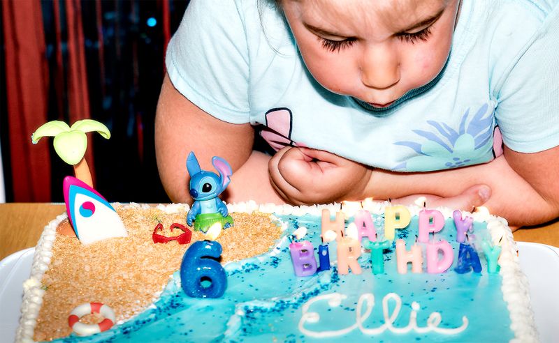 She is getting better at blowing out candles.  And I am pretty happy I caught her in mid blow.