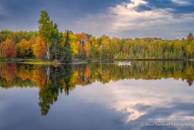 Peak fall colors at Audie Lake, perfect reflections with kayak