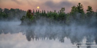 Setting full moon, fog and morning mist at a lake 2