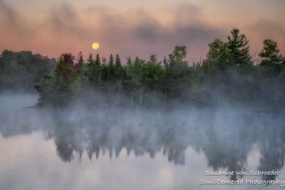 Setting full moon, fog and morning mist at a lake 3
