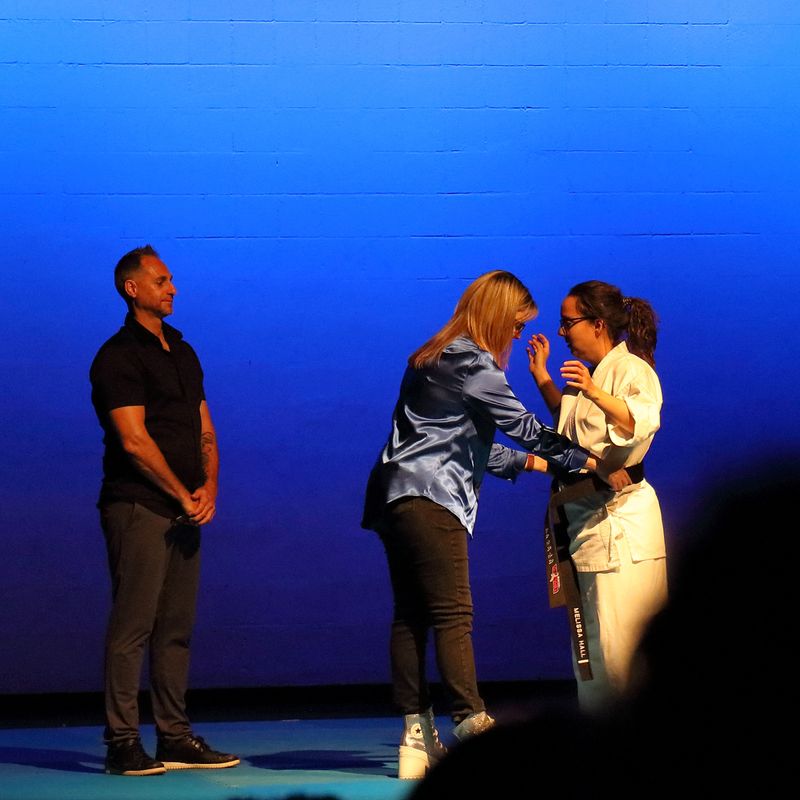 Melissa Receiving Black Belt 