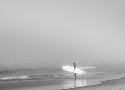 Surfer on a Foggy Morning