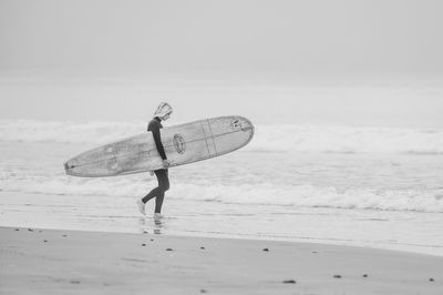 Surfer on a Foggy Morning