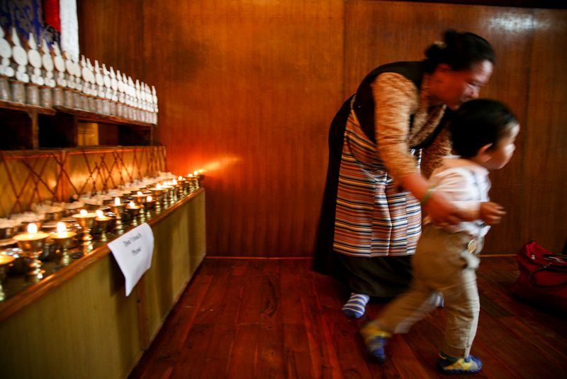 Offering at the Dalai Lama Temple, Dharamshala, India
