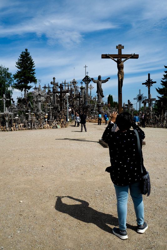 A Shadow of Her Hands Held Up, Hill of Crosses, Lithuania