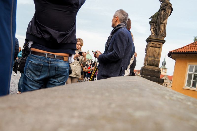 At the Wall of Charles Bridge, Prague, Czechia