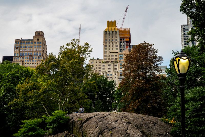Sitting on a Rock in Central Park, New York City, USA