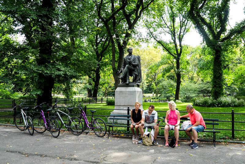 Four Cyclists and a Statue, Central Park, New York City, USA