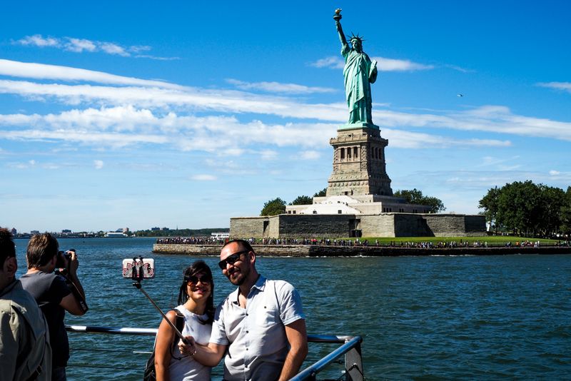 With Lady Liberty, New York, USA