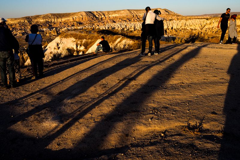 Long Sunset Shadows of Visitors, Goreme, Cappadocia, Turkey