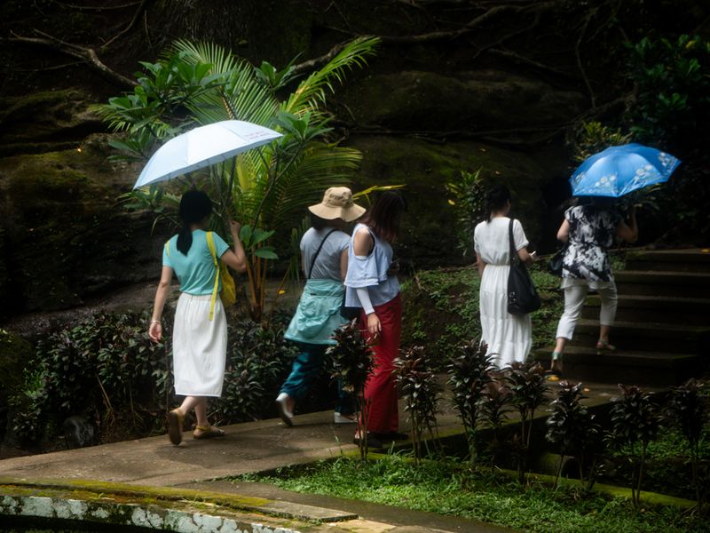 Women With Two Umbrellas, Goa Gajah, Bali, Indonesia
