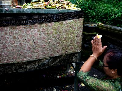With a Flower She Worships, Ubud, Bali, Indonesia