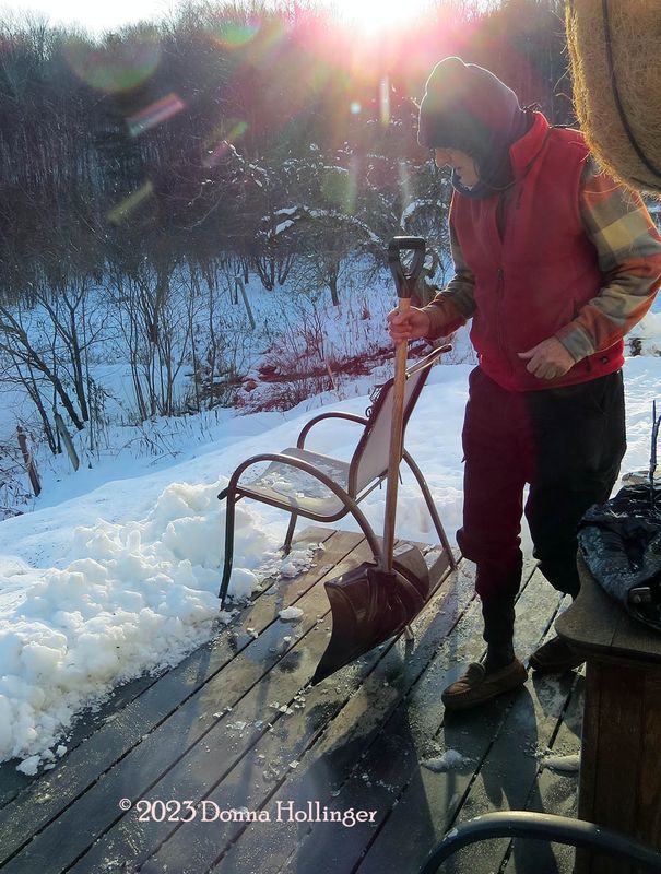Peter deicing the deck!