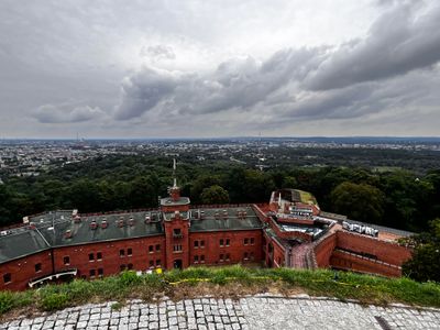 Some of the surrounding buildings of the fortress; Krakow in the background.